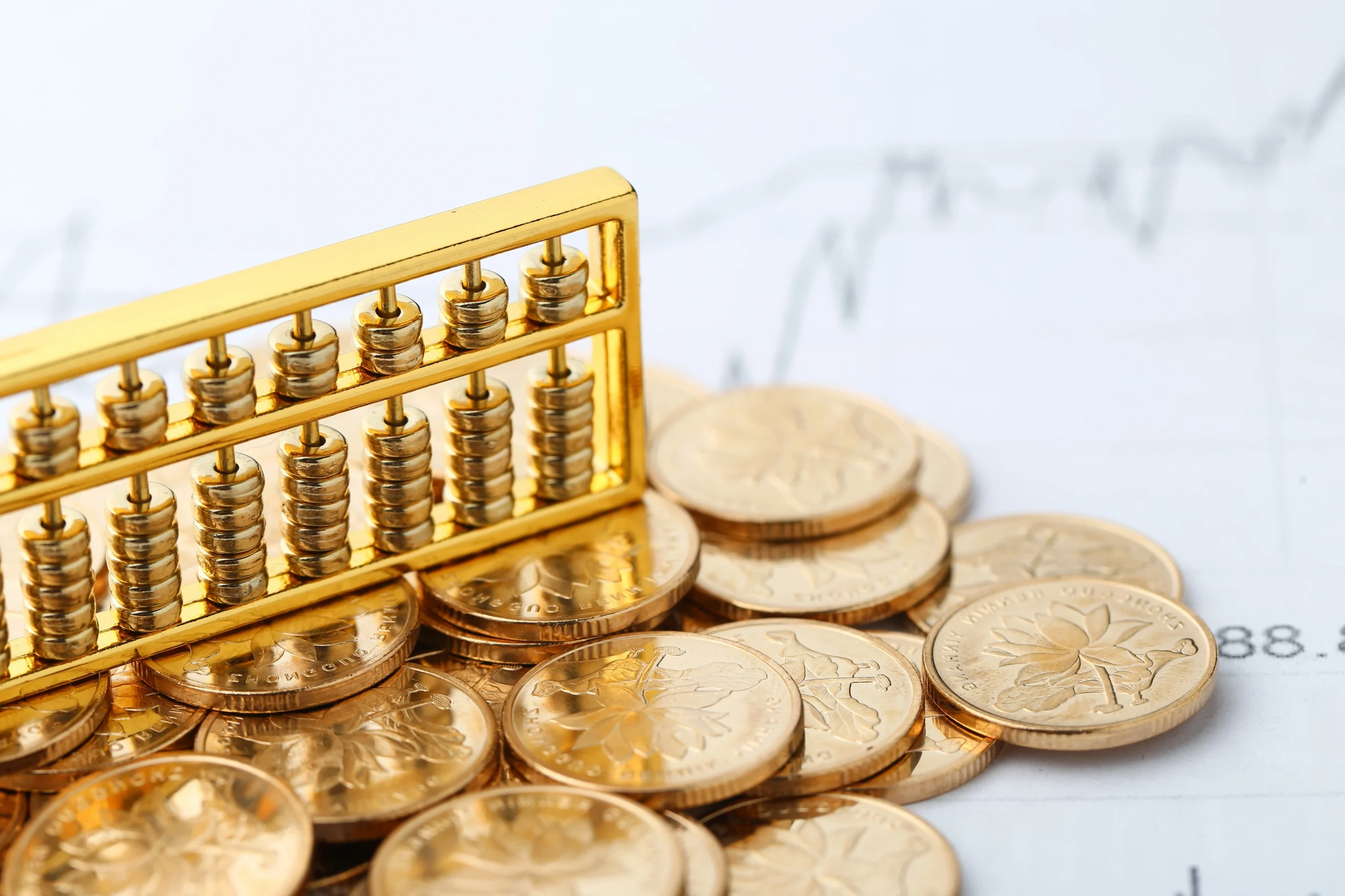 golden abacus with chinese rmb gold coins as background scaled