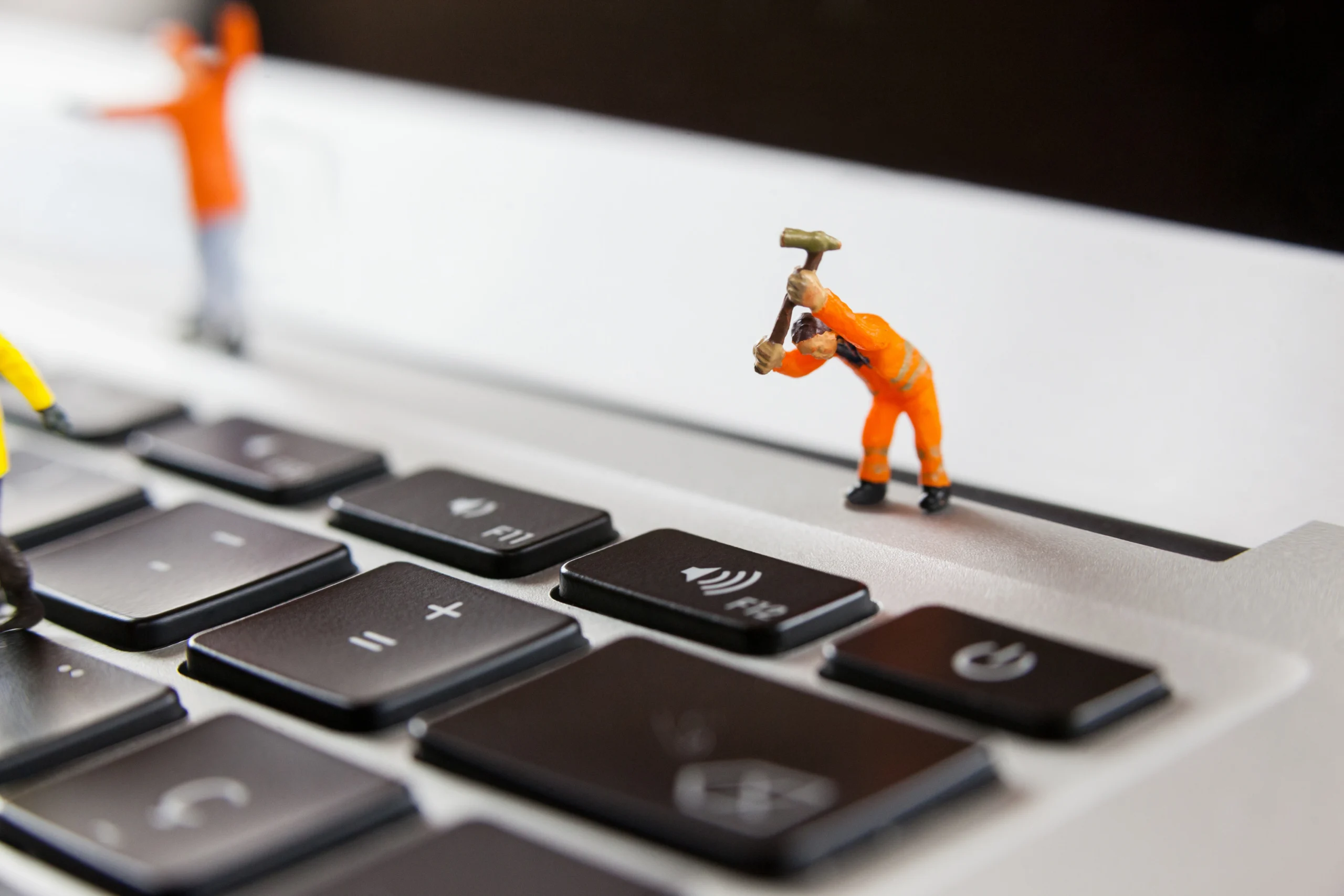 Trader resolving technical issues on laptop while managing multiple trading positions and error messages