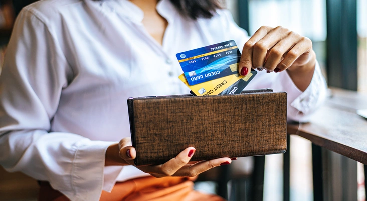 A Woman Making Payments with Prepaid Credit Card