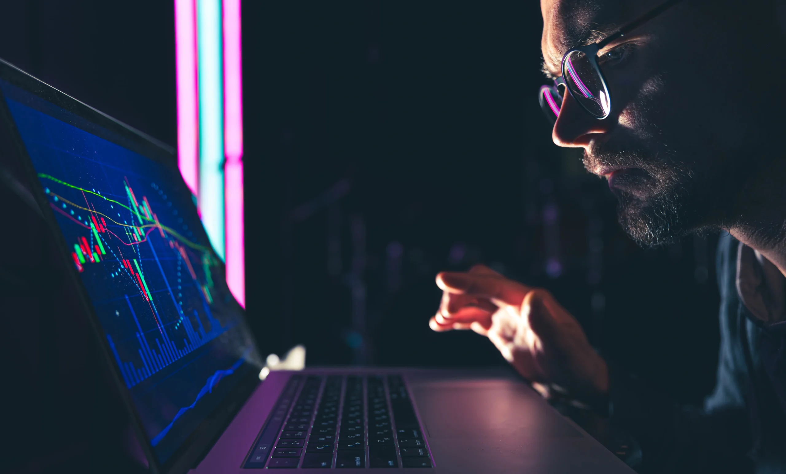 man analyzing stock market charts financial data electronic board scaled