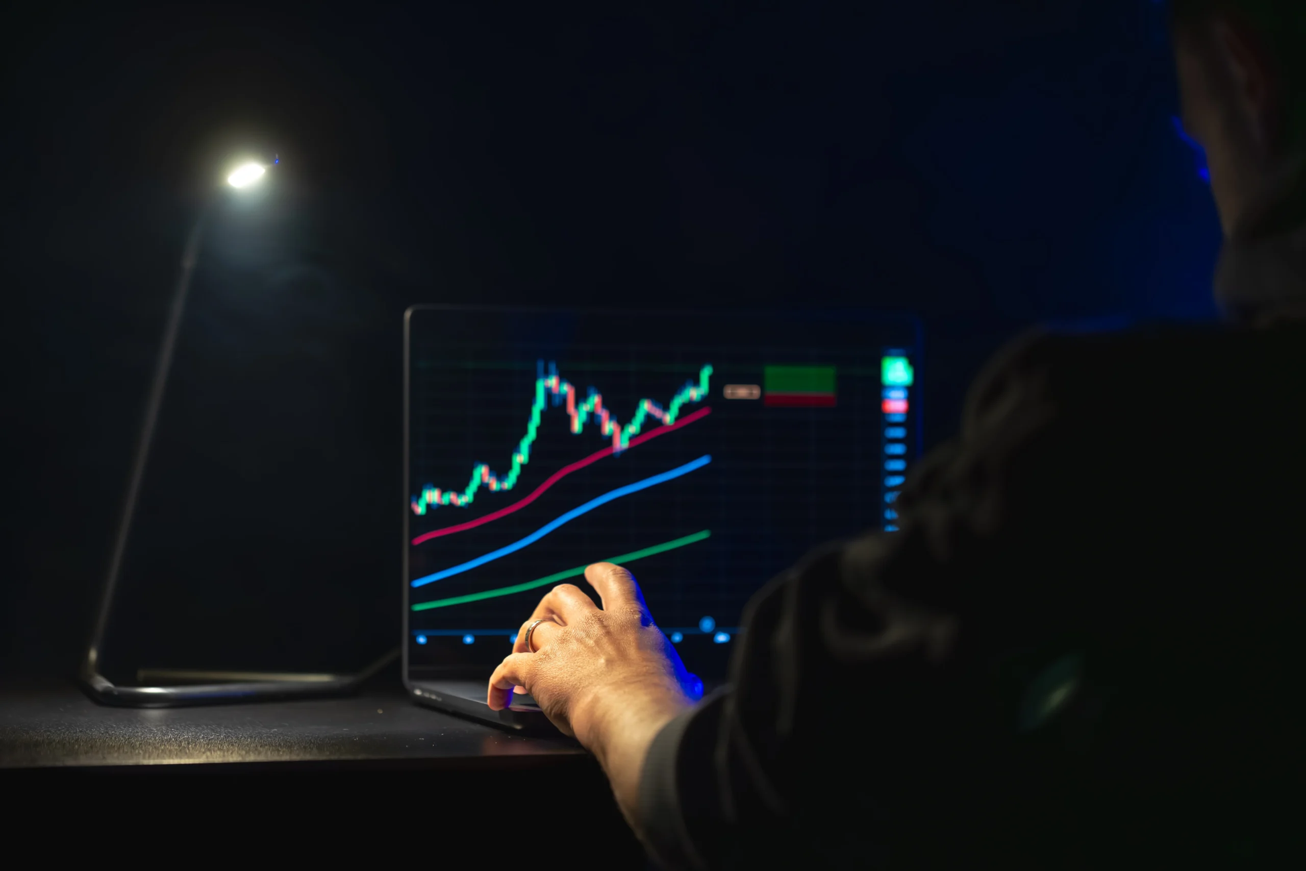 High-speed trading server room with multiple screens showing real-time futures market data and automated execution systems